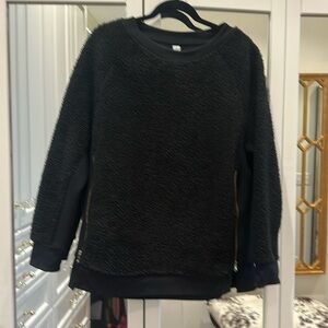 Black sweatshirt with gold zippers